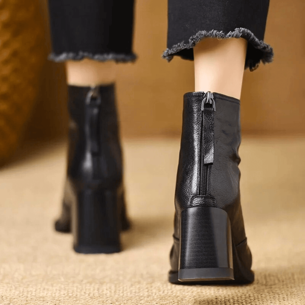 Heeled leather ankle boots — back view