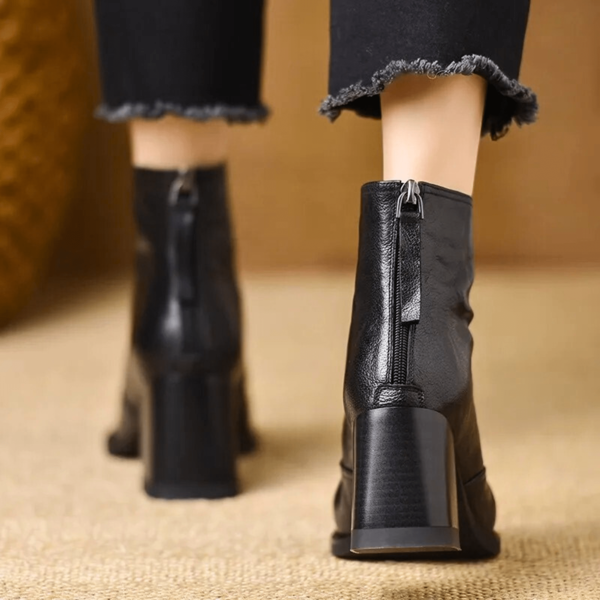 Heeled leather ankle boots — back view