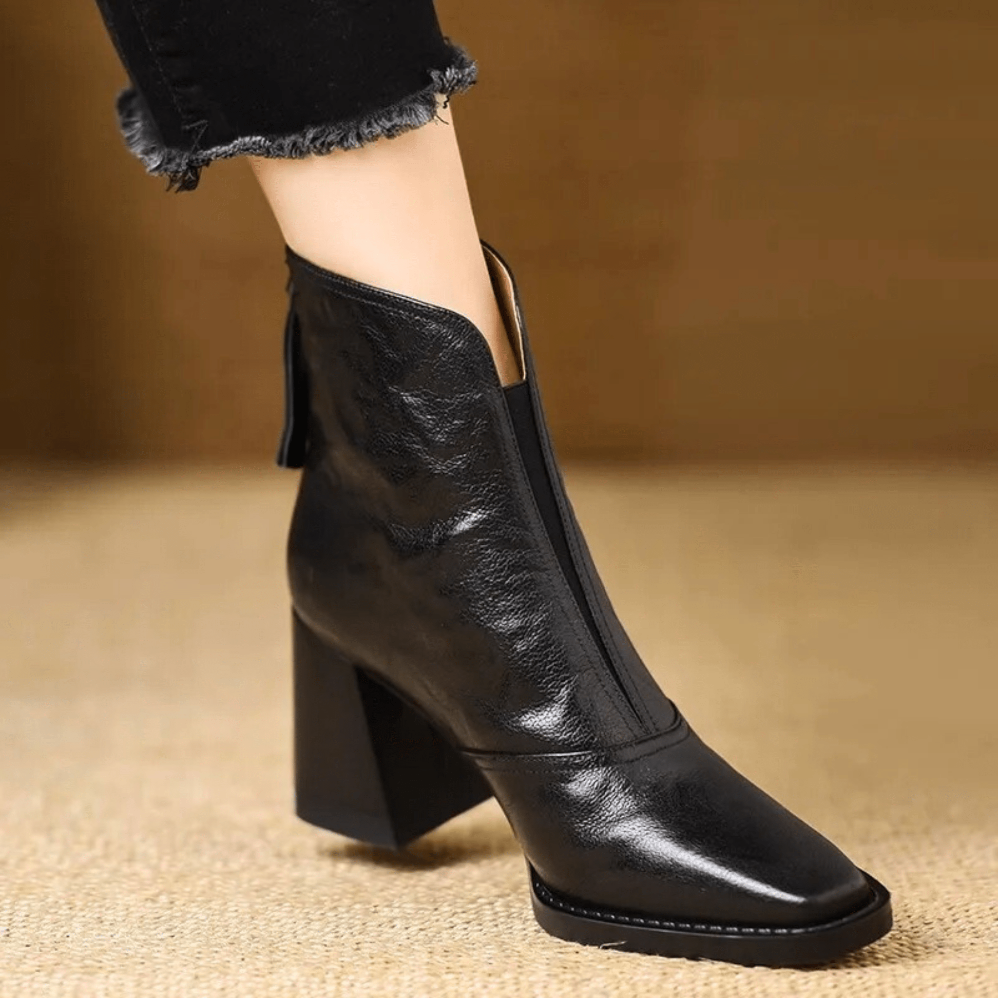 Heeled leather ankle boots in Midnight