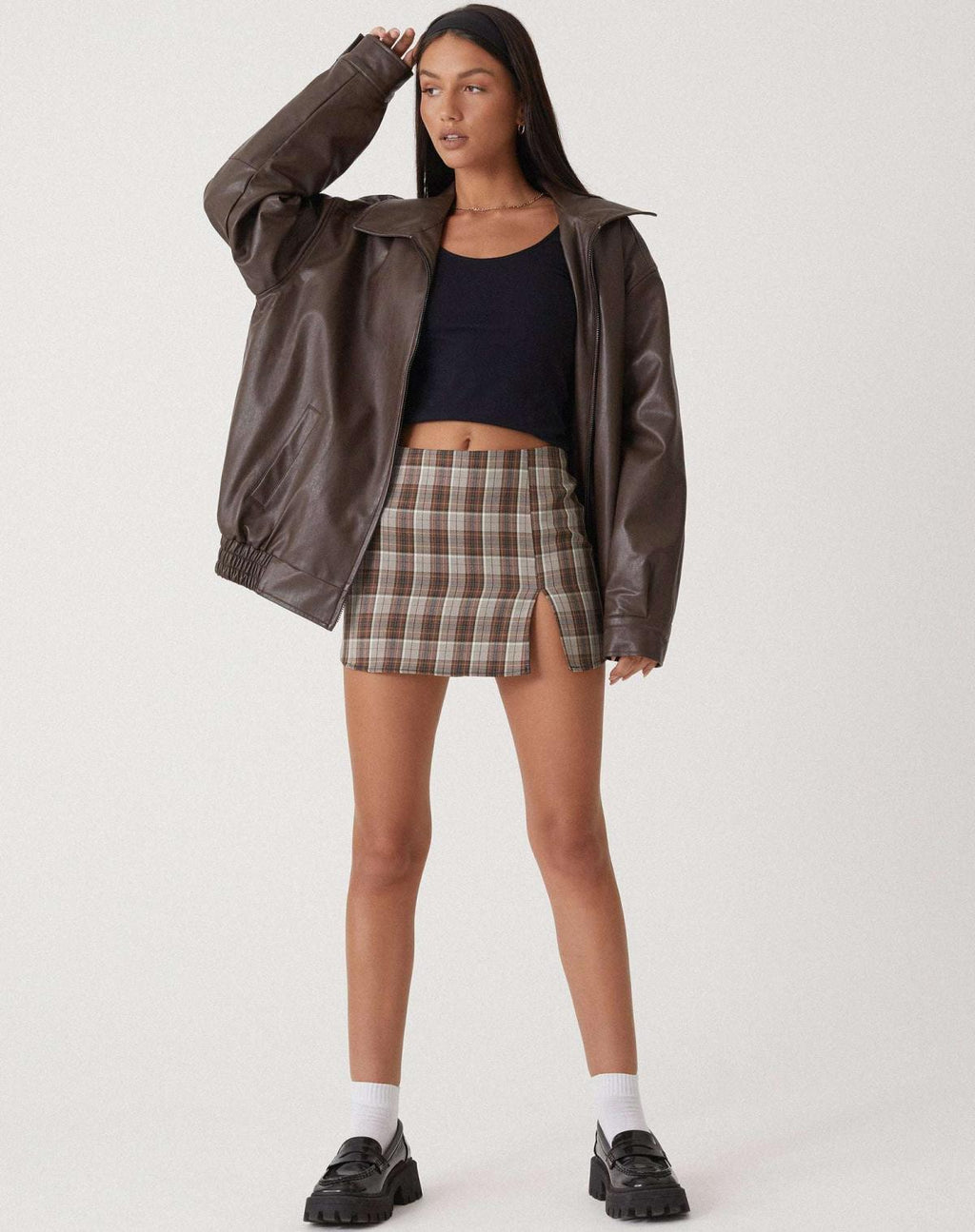 Oversized faux leather bomber jacket — detail of the fabric and stitching