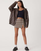 Oversized faux leather bomber jacket — detail of the fabric and stitching
