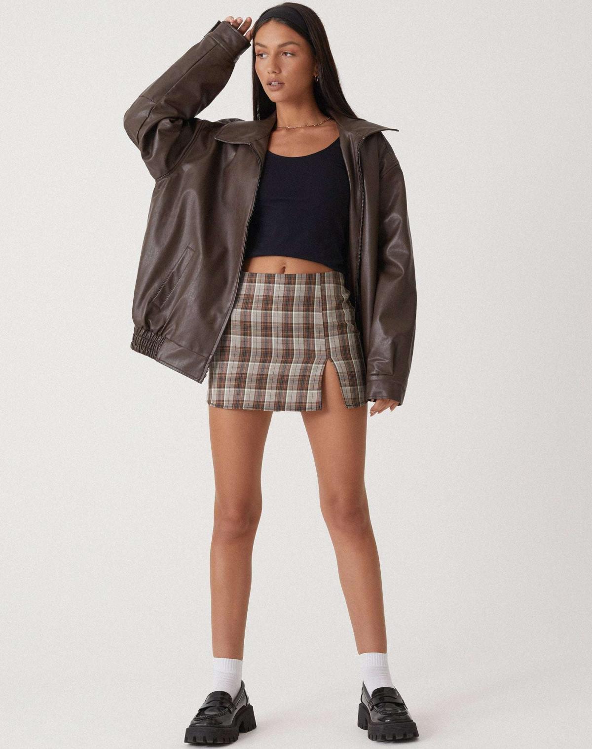 Oversized faux leather bomber jacket — detail of the fabric and stitching