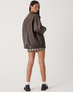 Oversized faux leather bomber jacket — back view